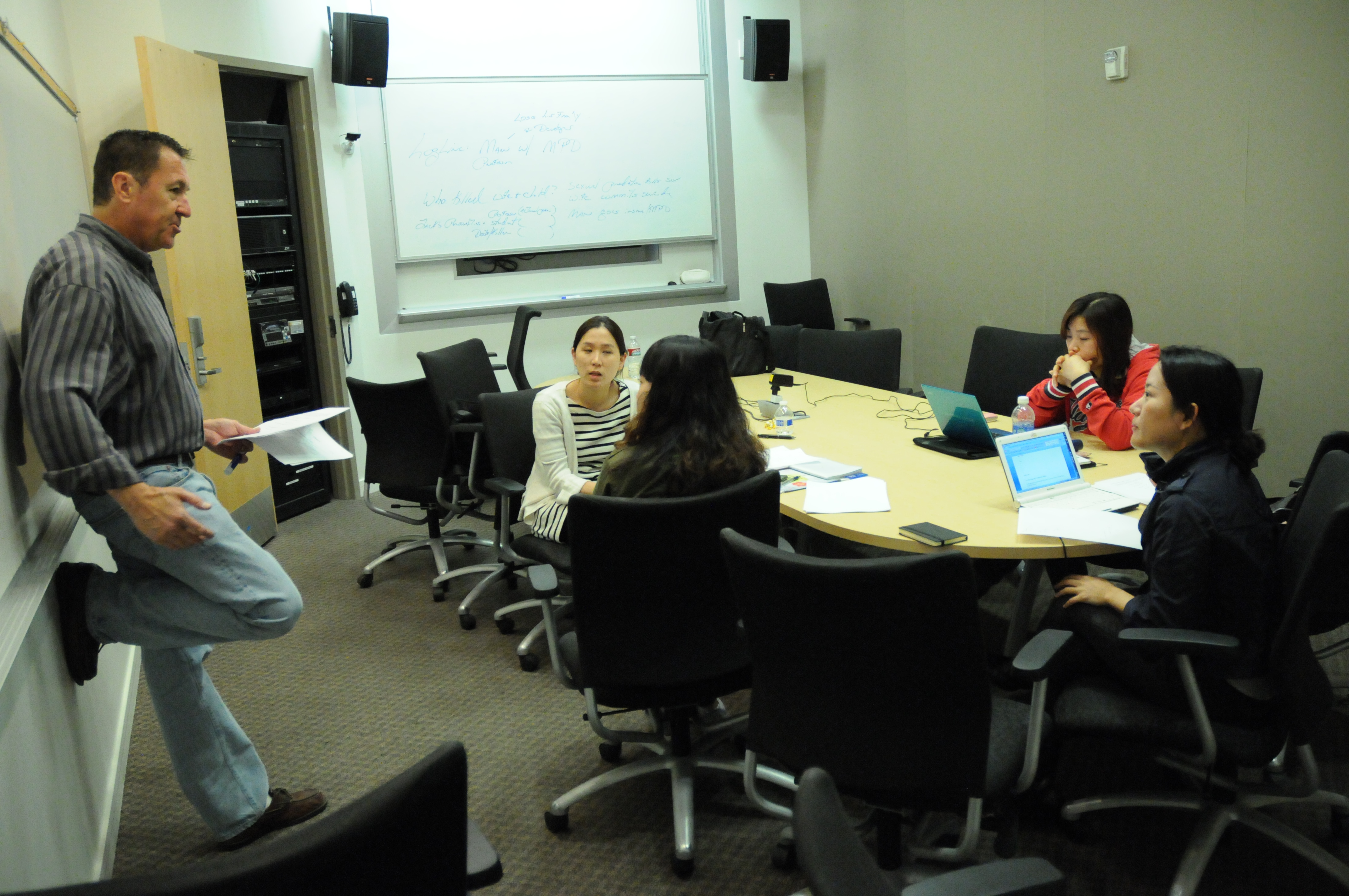 image of Korean Exchange students discussing screenwriting