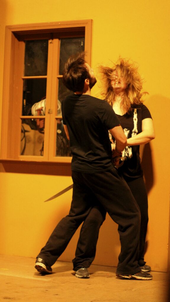 students learning how to sword fight safely as part of interterm stunts class at Dodge College
