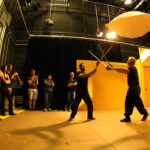 students learning how to sword fight safely as part of interterm stunts class at Dodge College