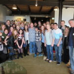 At PIXAR, Oscar-winning founder JOHN LASSETER (center) explained the significance of the design concept behind the STEVE JOBS BUILDING, PIxar’s man production facility.