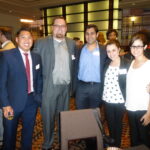 Dodge College alums pose for a photo at an alumni mixer