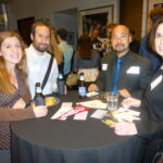 Dodge College alums pose for a photo at an alumni mixer