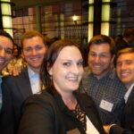 Dodge College alums pose for a photo at an alumni mixer