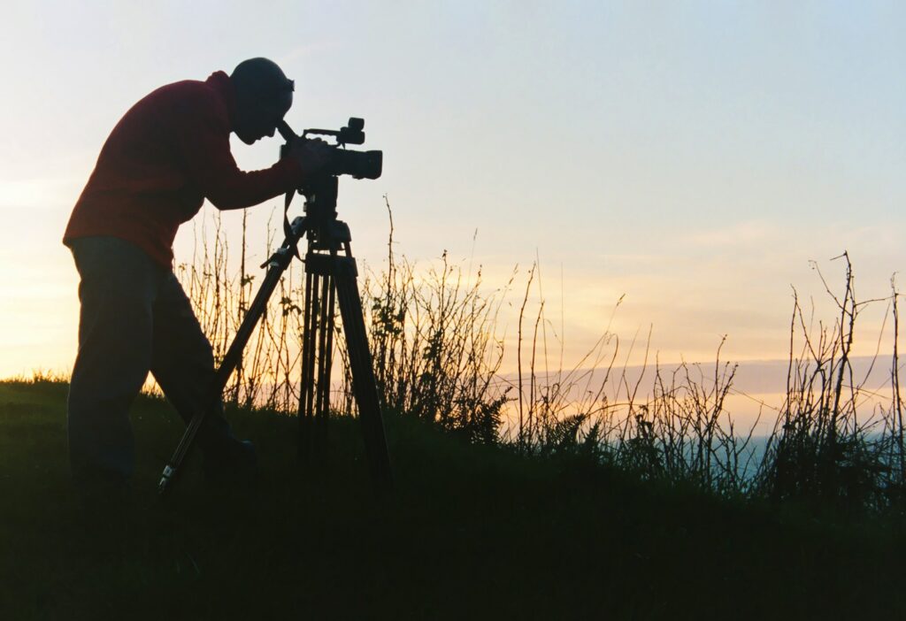 A student with a camera on location.