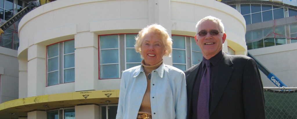 Image of building founder Marion Knott and Dean Bob Bassett in front of Marion Knott Studios during the building phase.