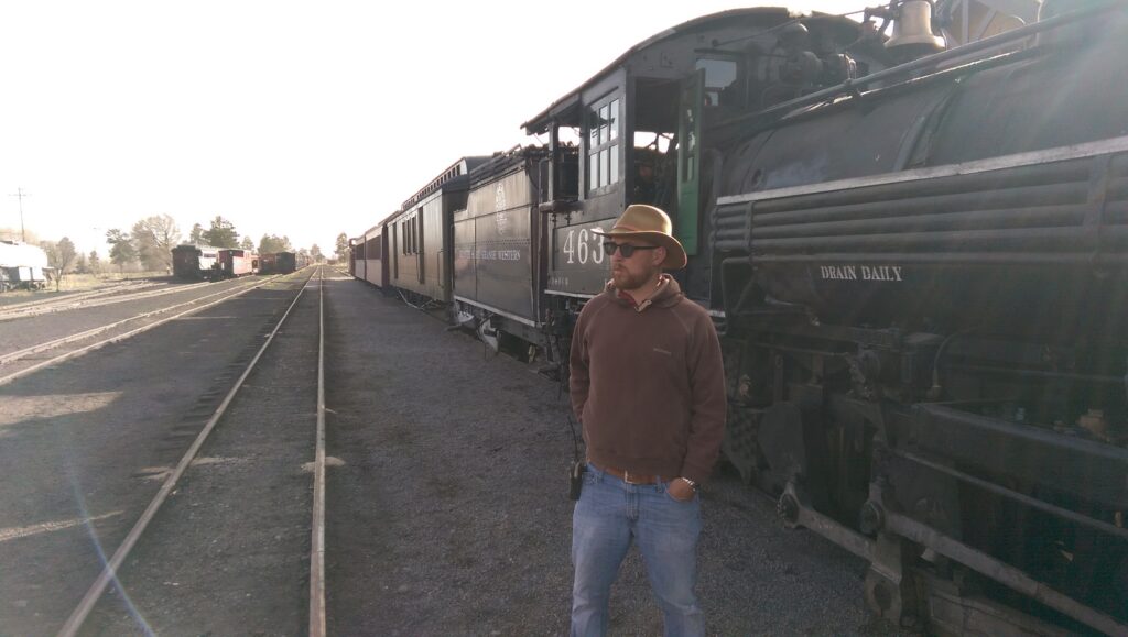 man in front of train engine