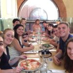 students enjoying a meal in bologna