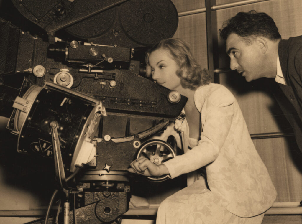 woman at helm of camera in 1930s