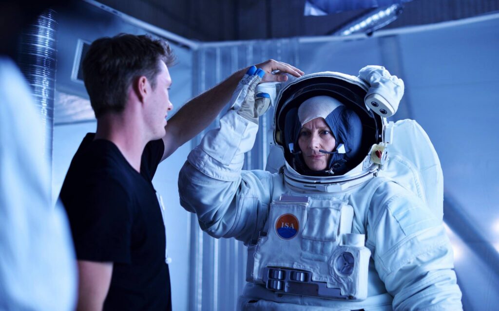 astronaut on set with director