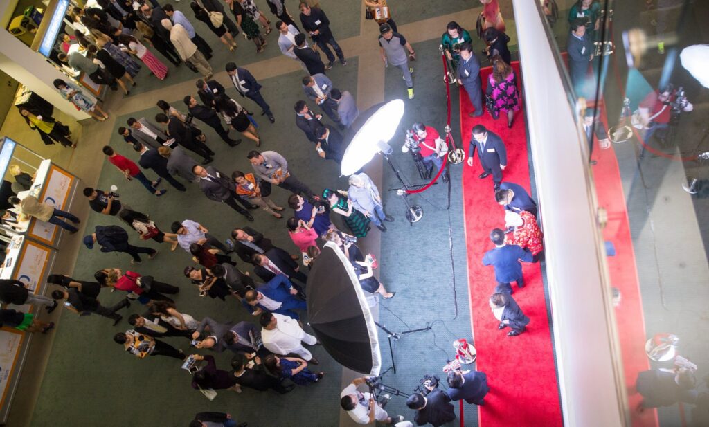 birds eye shot of a group on a red carpet