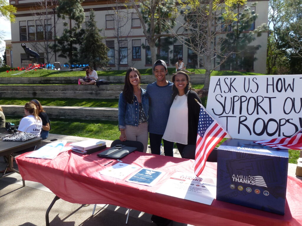 project vets volunteers at their table on main campus
