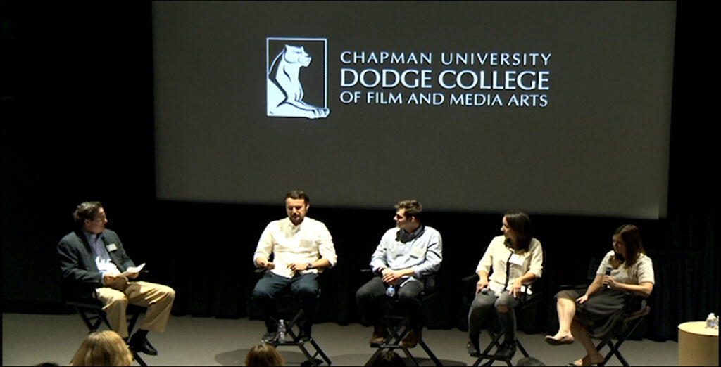 alumni sitting in the dmac talking about what they have been up to