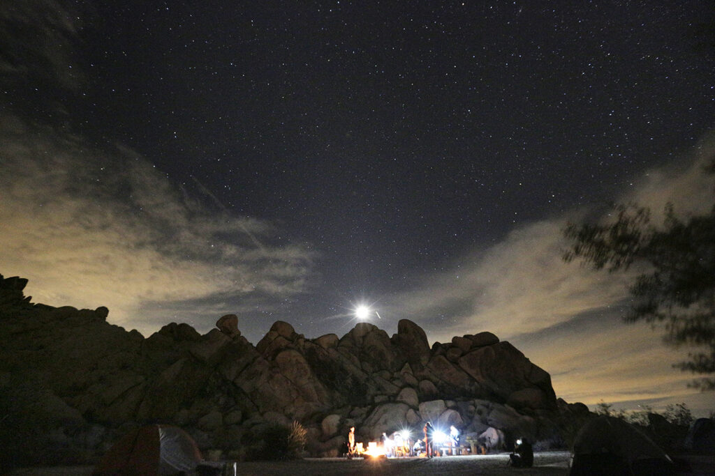 rock formation with people standing below