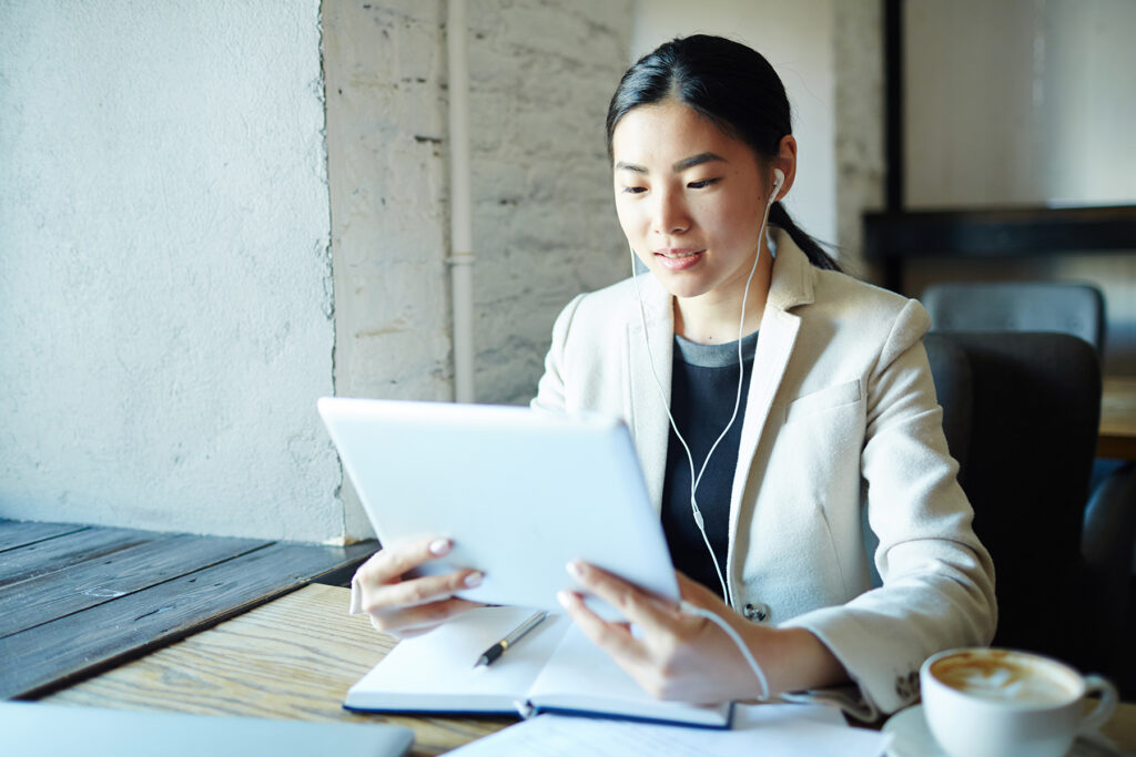 woman with tablet at desk