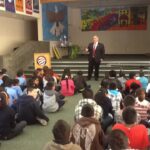 Dean Cardinal at assembly of students