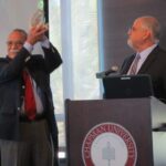 Dean Don Cardinal presenting Dr. Mike Madrid with an award for recognition of outstanding service