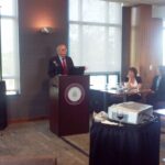 Dr. Mike Madrid giving a thank you speech