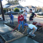 Students working on a sidewalk in New Orleans.