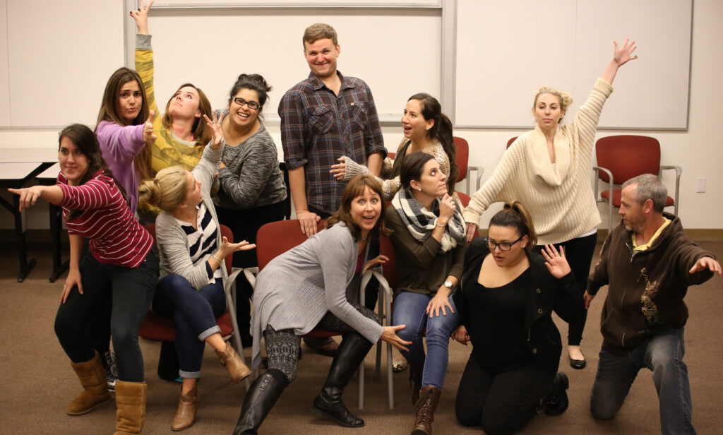 Group of people striking different dramatic poses.