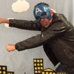 Doctoral student John Naghshineh strikes a superhero pose