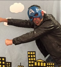 Doctoral student John Naghshineh strikes a superhero pose