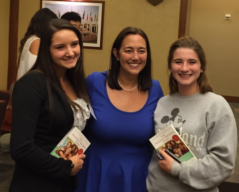 Three women smiling.