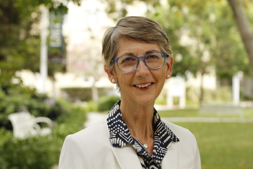 Dean Margaret Grogan standing outside on a sunny day