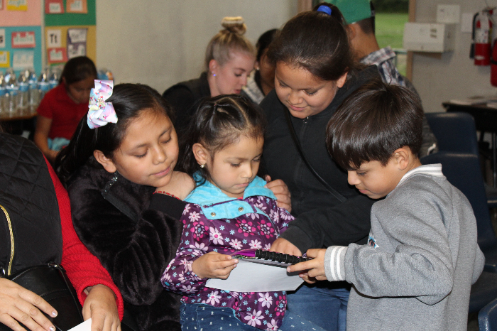 Kathleen Muth Reading Center student with family