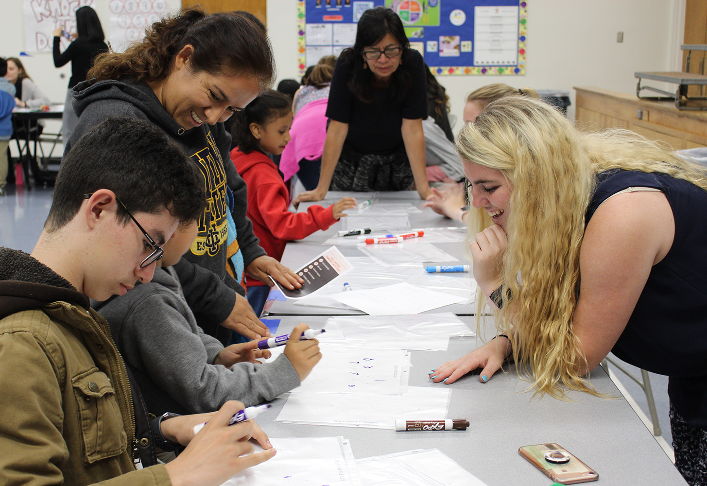 Chapman student leading g at station at Community Math Night