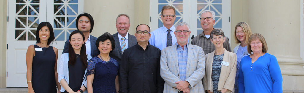 Shanghai Normal University and Chapman University leandership on steps of Memorial Hall
