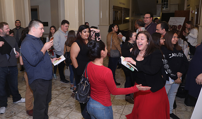 Attendees in Memorial Hall at the Freedom Writers reception and book signing following the panel discussion