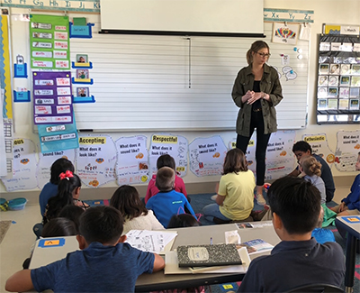 Stephanie Weinfeld teaching youth in a classroom