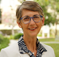 Dean Margaret Grogan standing outside