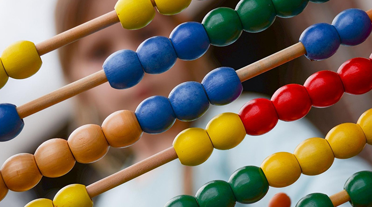 Child looking at abacus