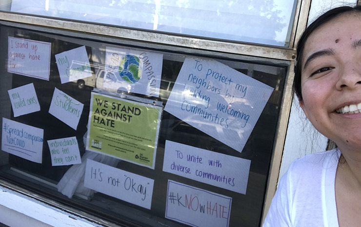 Fatima Pineda with her kNOw Hate window display