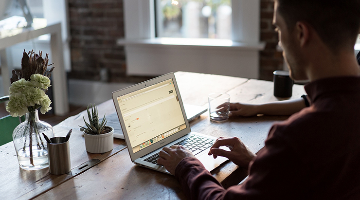Man working on laptop at home