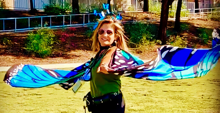 Katerina Sorrell (MA in School Counseling '14) wearing fairy wings at an elementary school)