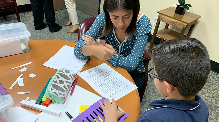 Chapman student tutoring 3rd grade math student