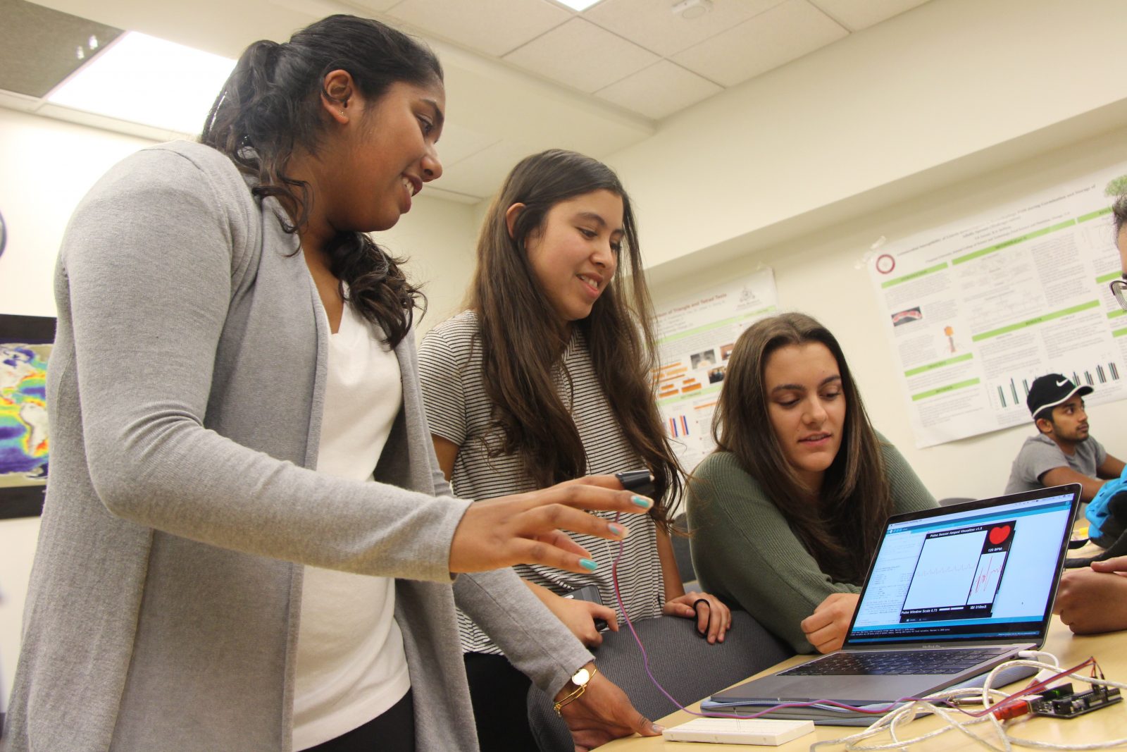 Sanika Pandit working with her team during her experience in the Grand Challenges Initiative