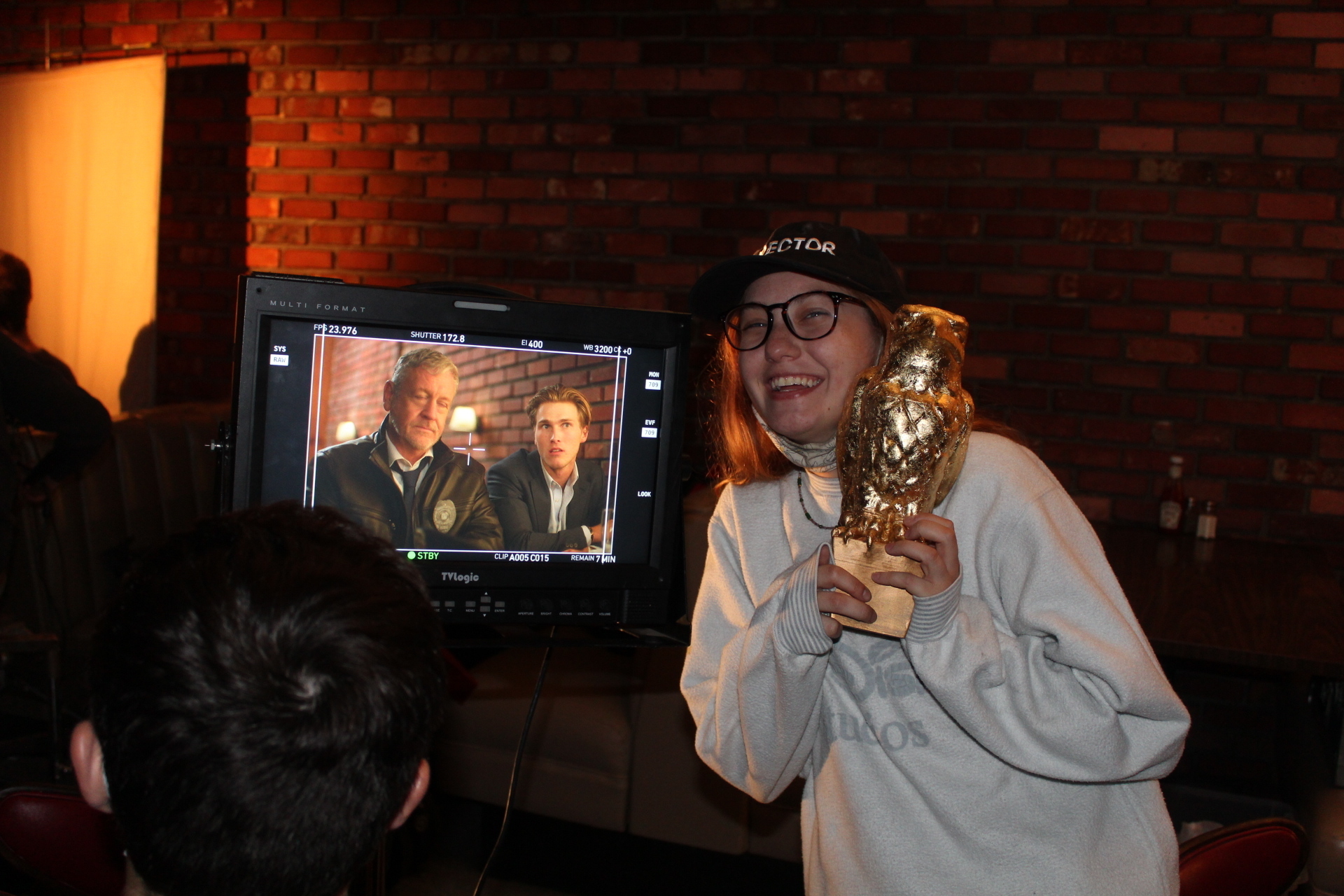 on set with owl statue