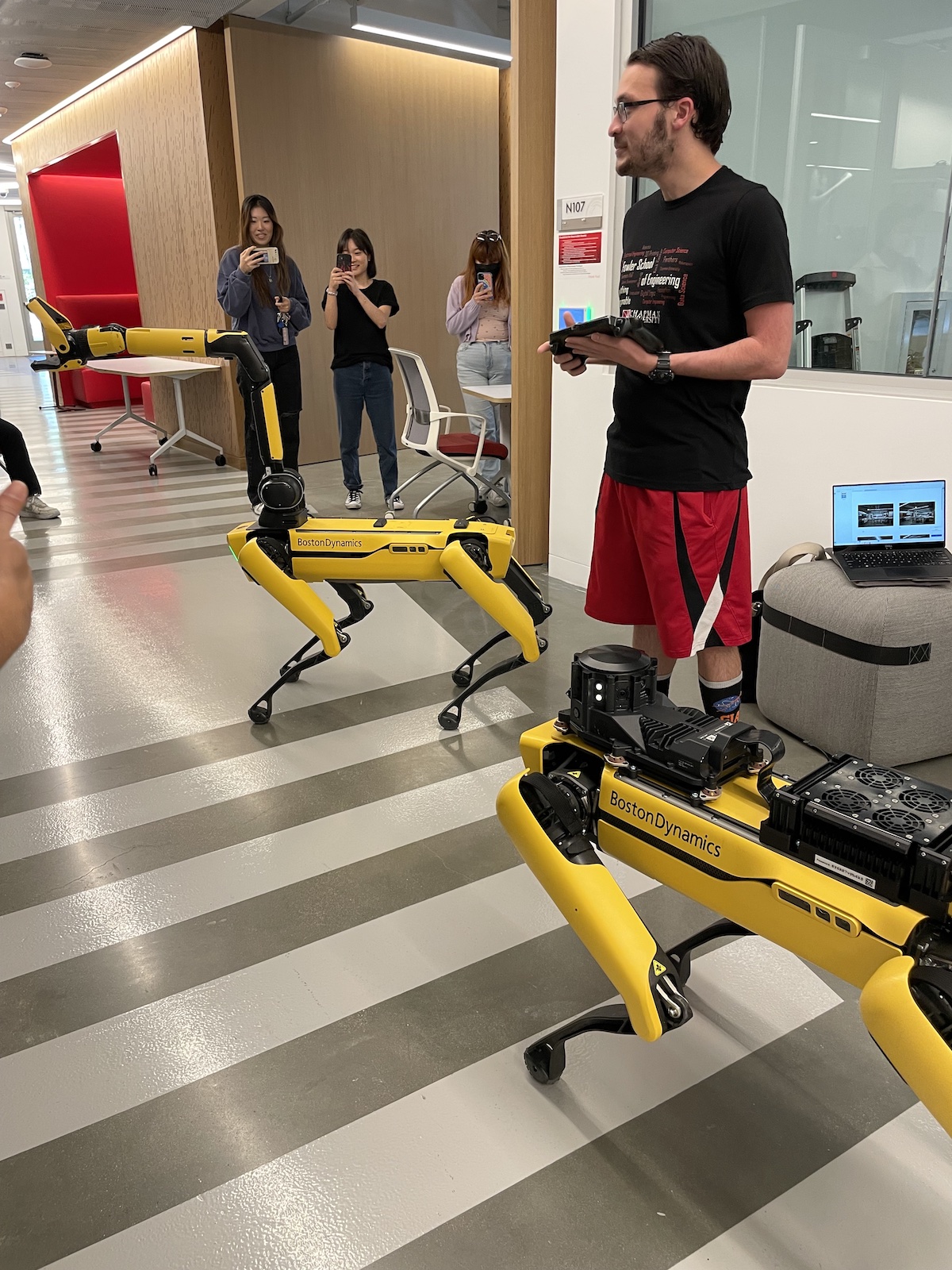 Student guiding Spot the robot