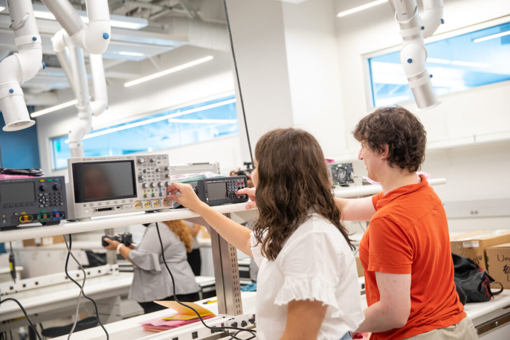 Two students using the lab equipment