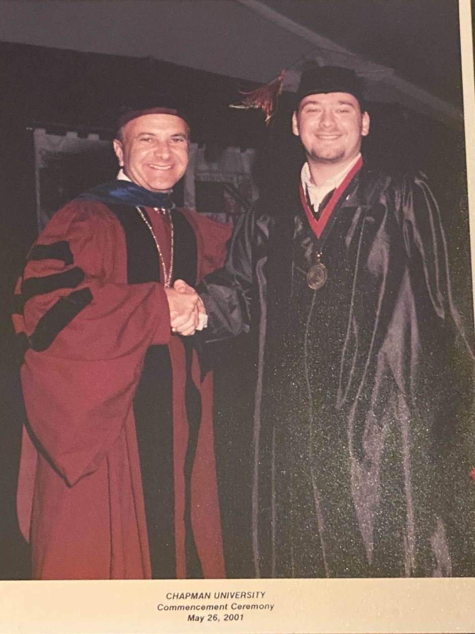 Erik Linstead '01 with former Chapman president Jim Doti at his commencment.