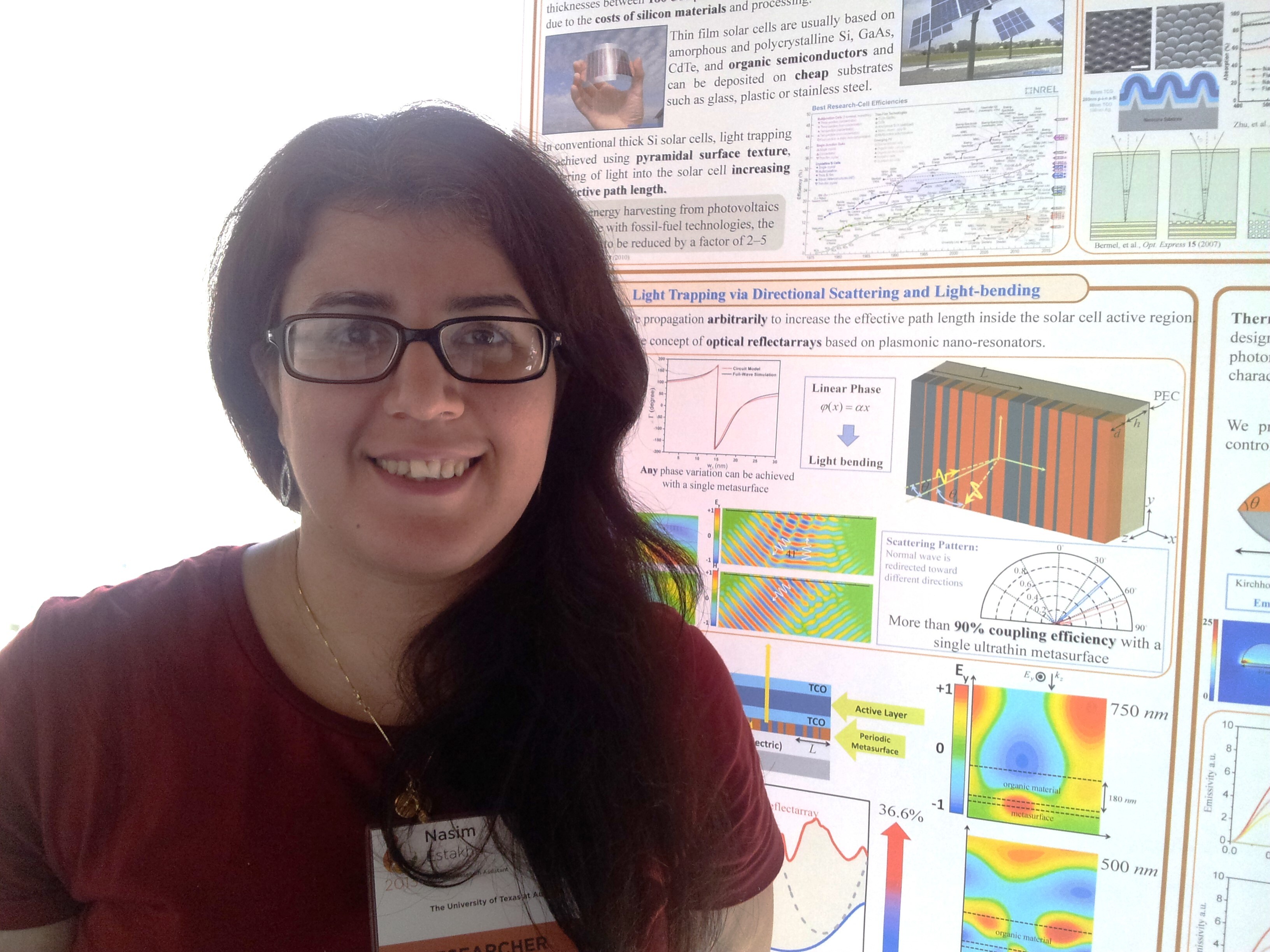 Dr. Estahkri in front of research poster
