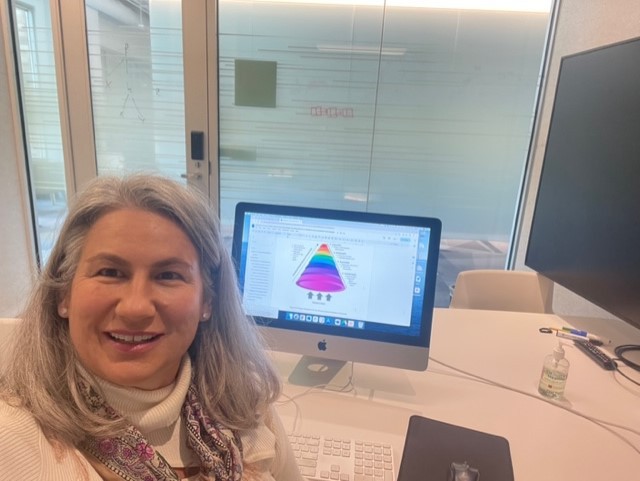 Boyd in front of her computer writing her book.