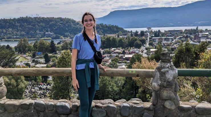 Evelyn Lawrie posing with a small town in Chile in the background.