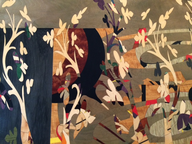 image of marquetry artwork displaying vines and flowers