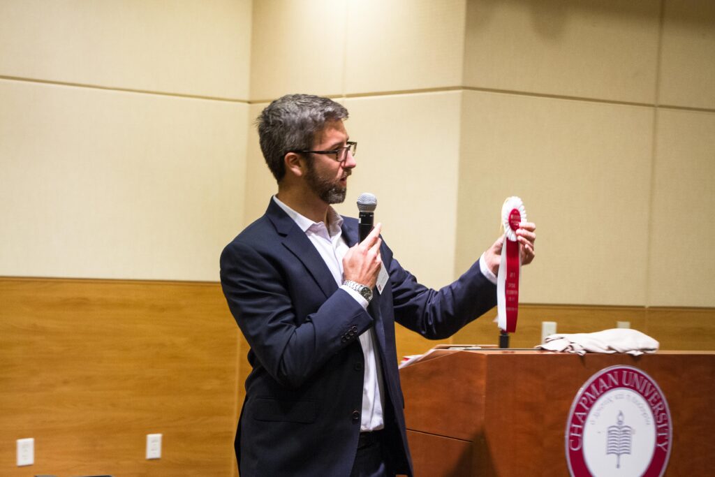 GCI director presenting awards at the 2019 GCI Spring Showcase