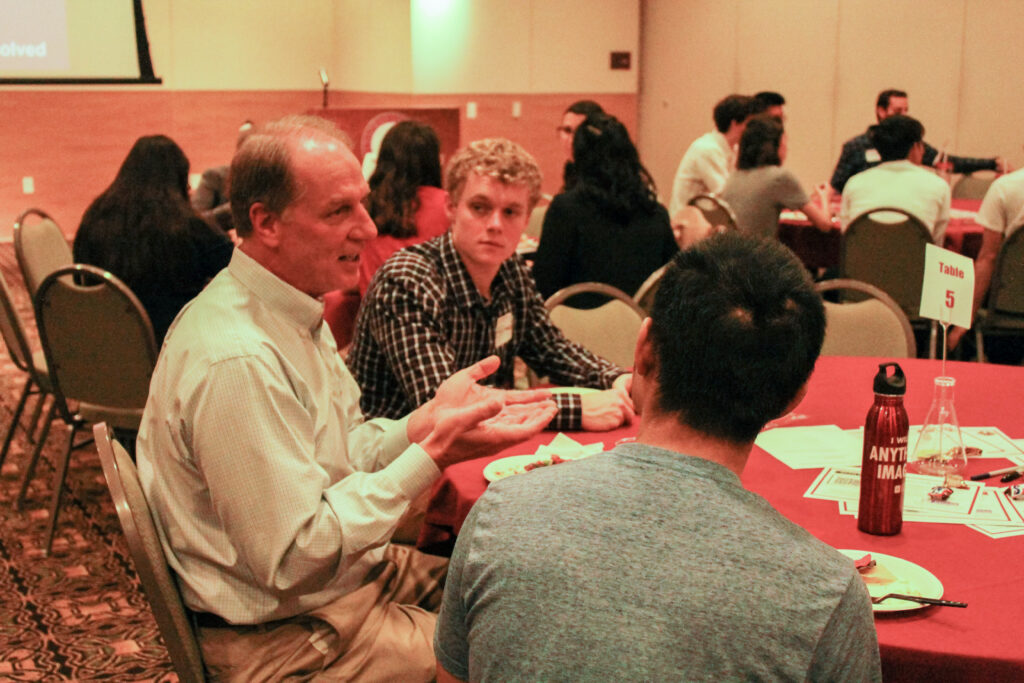 GCI students talking with industry professionals