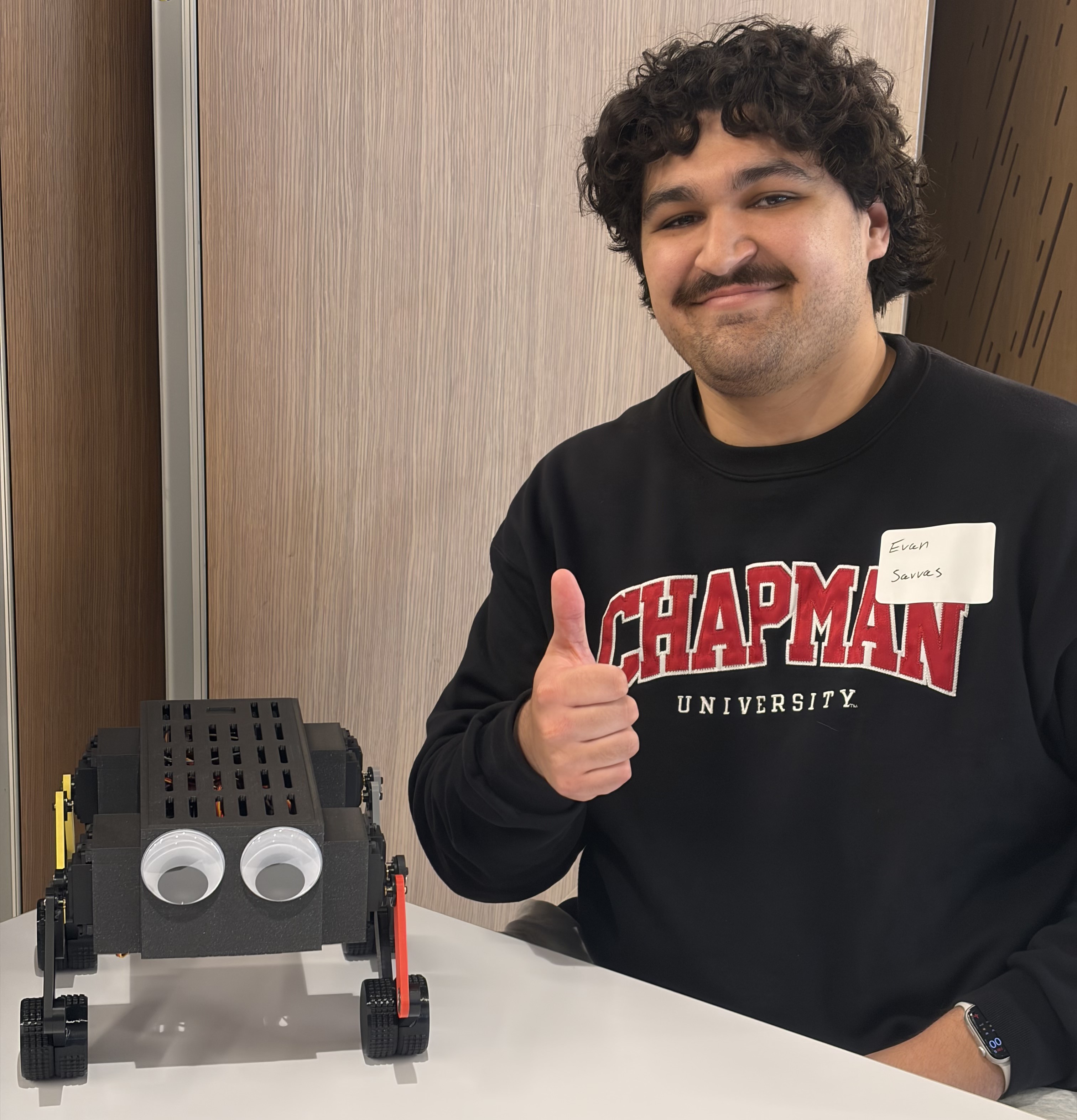 Evan Savvas and his 3D-printed robot.